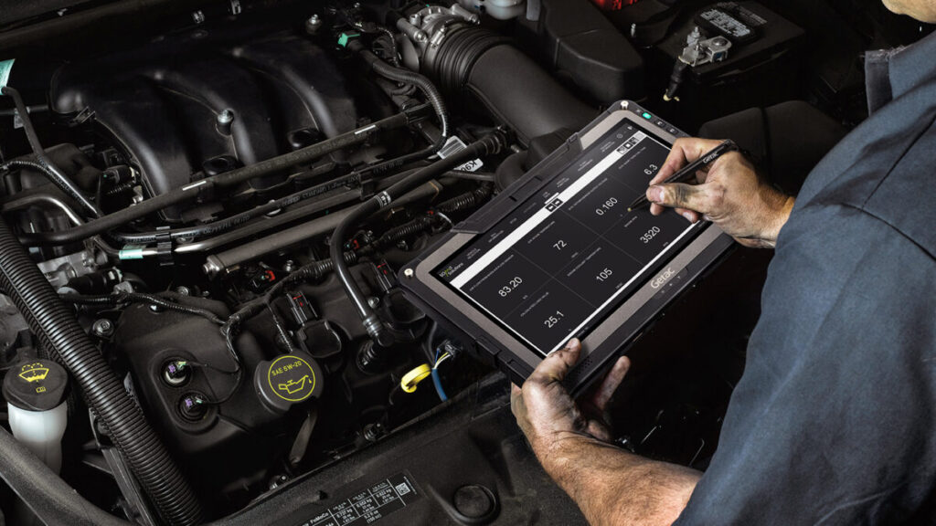 A mechanic using the tablet