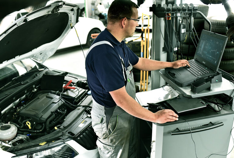 A mechanic using the computer