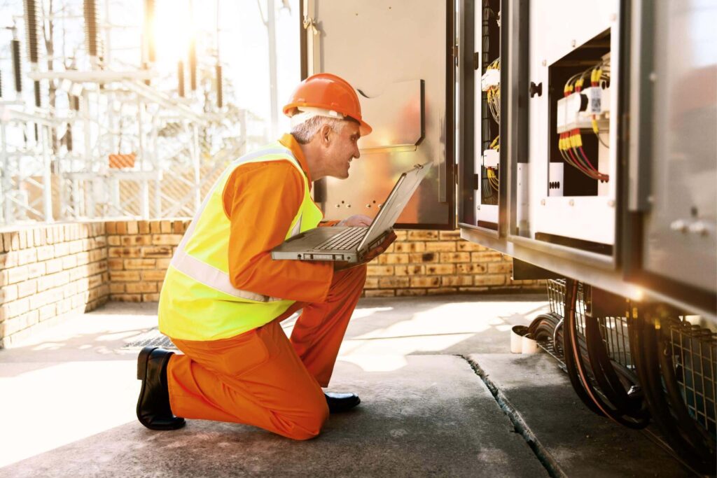 Worker setting the parameters of the machine